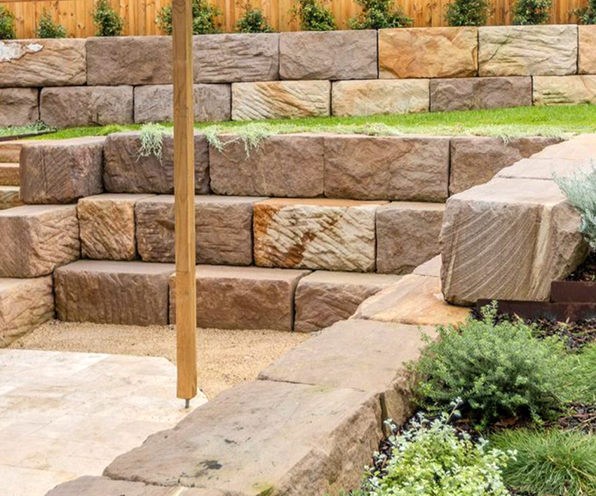 Professionally built retaining wall with landscaped garden