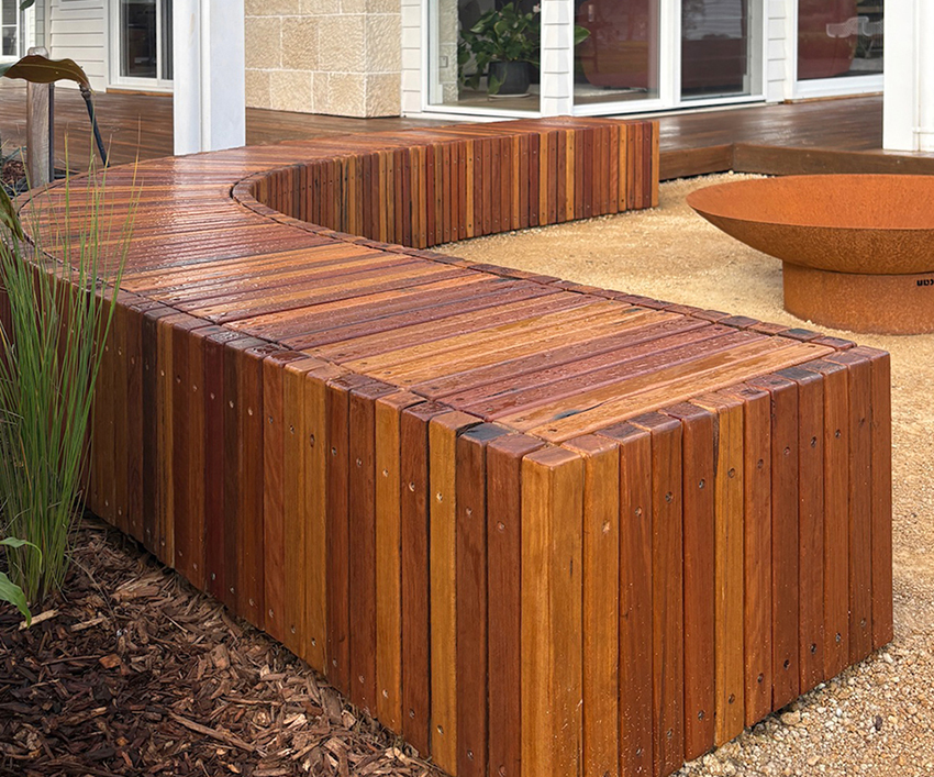Timber bench seating integrated into a modern landscape design.